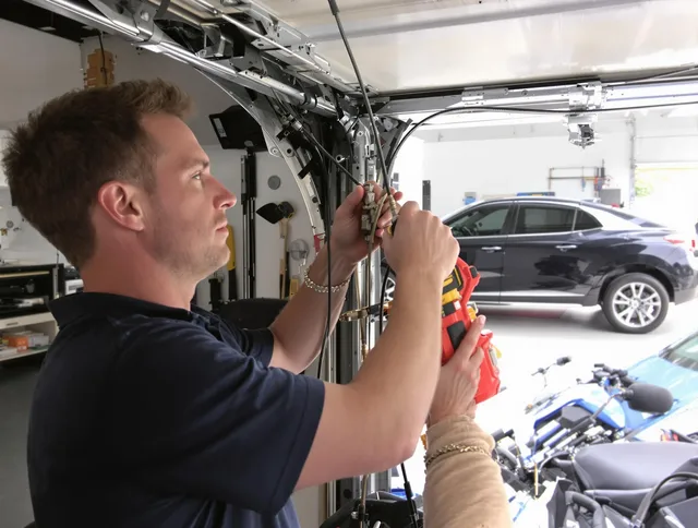 Avon Lake Garage Door Repair safety certified technician performing cable replacement in Avon Lake