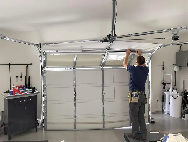Avon Lake Garage Door Repair specialist performing precise section replacement on Avon Lake garage door