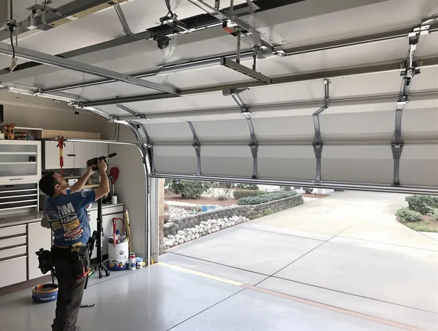 Garage door track repair service by Avon Lake Garage Door Repair in Avon Lake